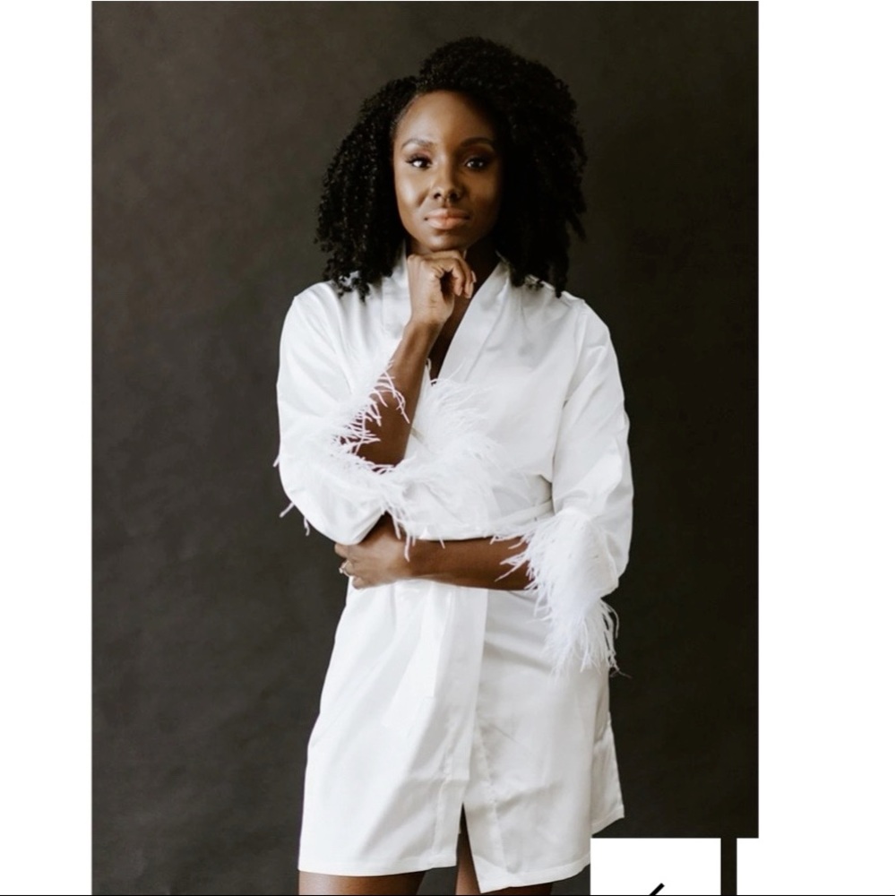 White robe with feathers